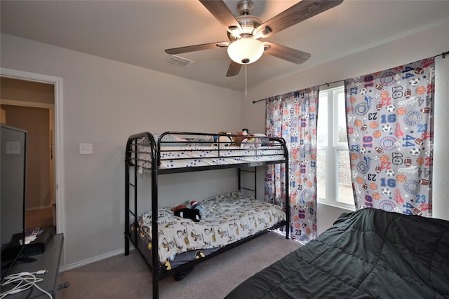 bedroom with ceiling fan and carpet