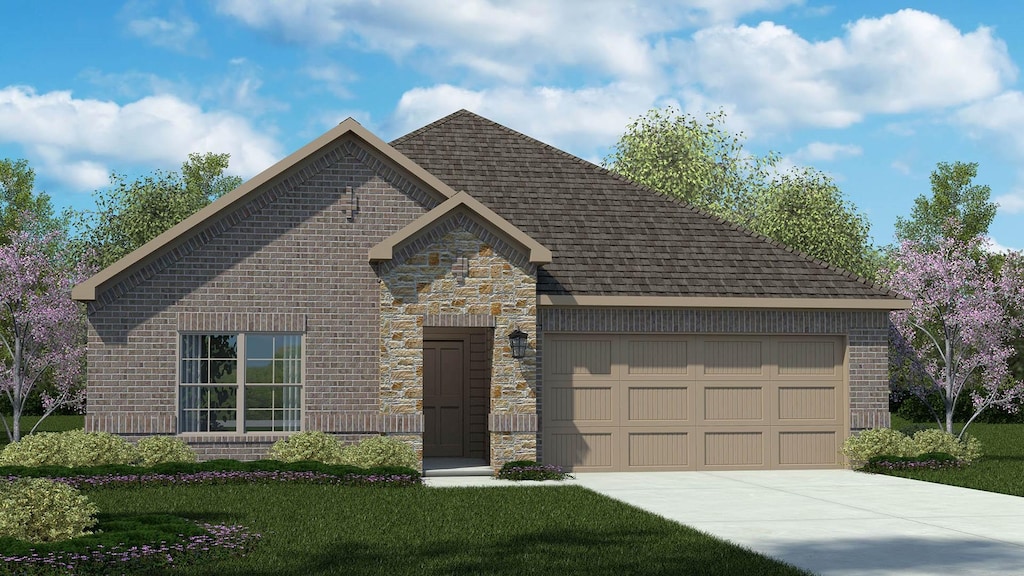 view of front of house with a garage and a front lawn