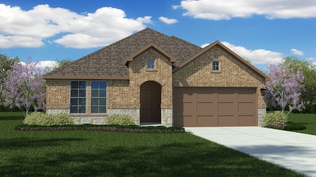 view of front of property with a garage and a front yard