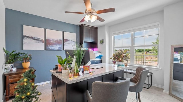 office space featuring ceiling fan and light tile patterned floors