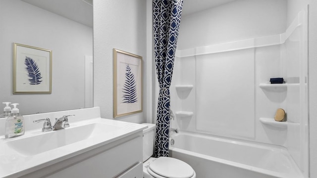 full bathroom featuring vanity, shower / tub combo, and toilet