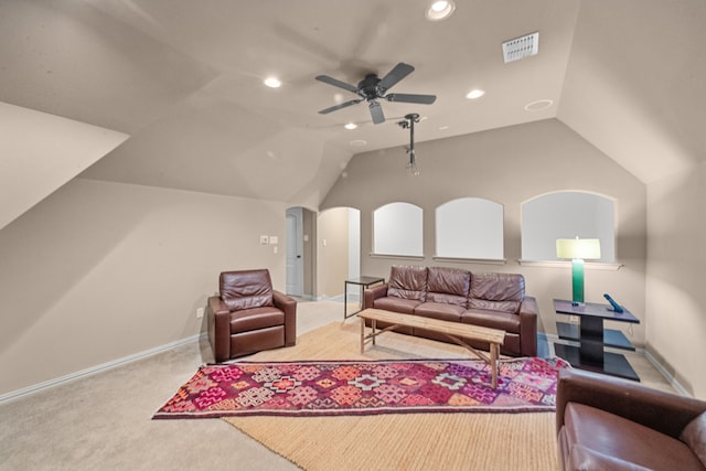 living room with ceiling fan, lofted ceiling, and carpet floors