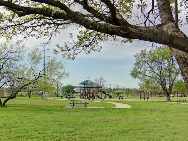 view of community with a playground and a lawn