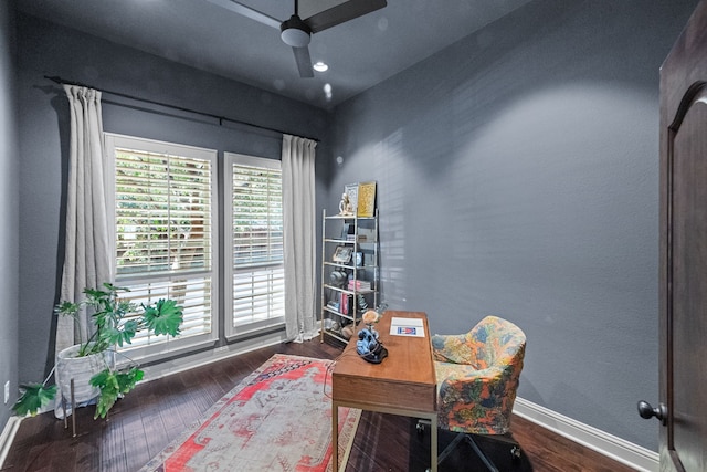 office with ceiling fan and dark hardwood / wood-style flooring