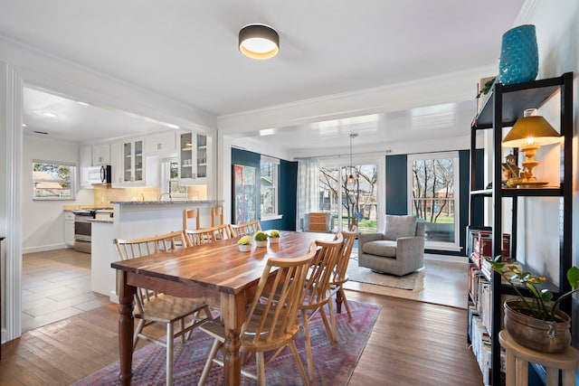 dining area with dark hardwood / wood-style floors