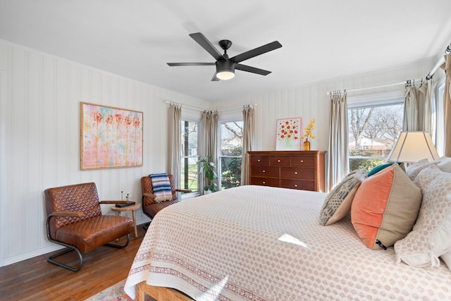 bedroom featuring wood-type flooring and ceiling fan