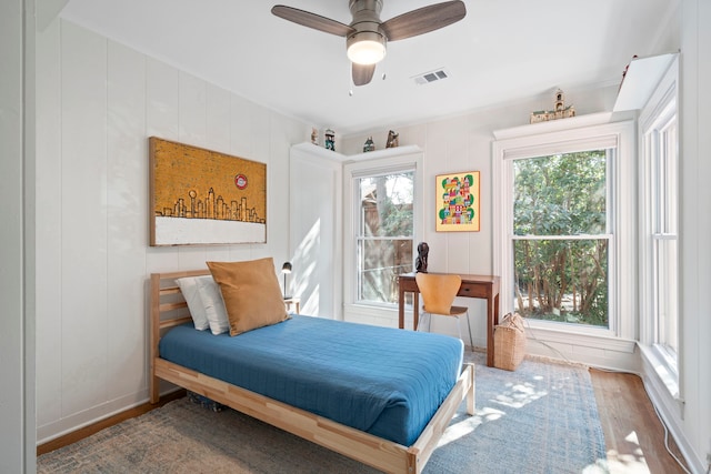 bedroom featuring hardwood / wood-style floors and ceiling fan