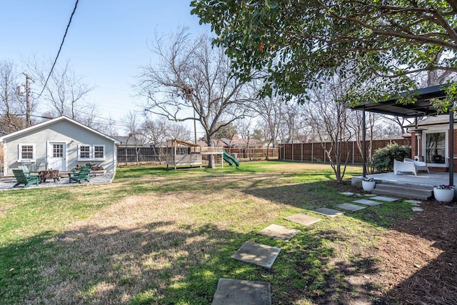 view of yard featuring a playground and a deck