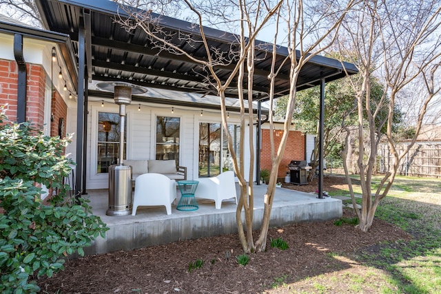 view of patio featuring a grill