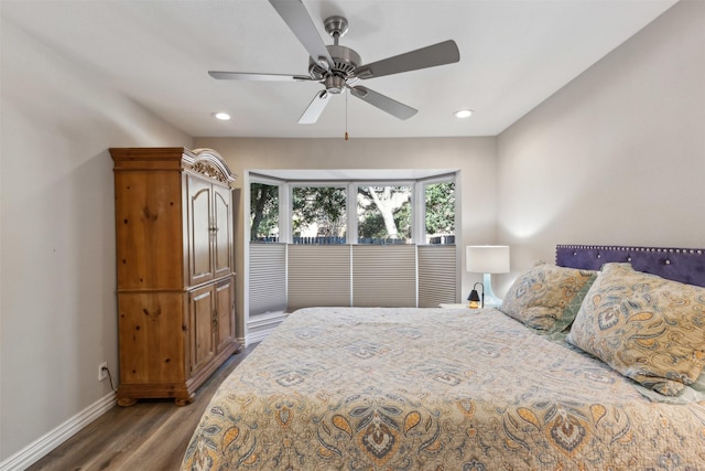 bedroom featuring dark wood-type flooring and ceiling fan