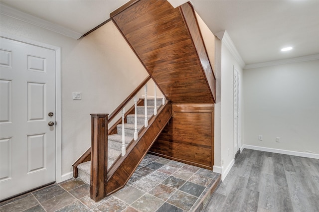 foyer with dark hardwood / wood-style flooring and crown molding