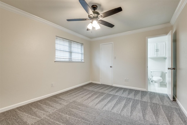 unfurnished bedroom with carpet floors, ornamental molding, ceiling fan, and ensuite bathroom