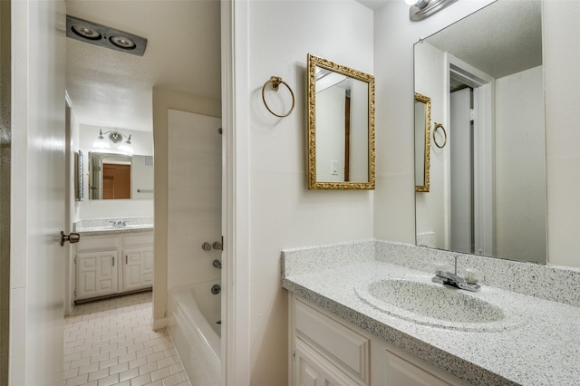 bathroom with tile patterned floors and vanity