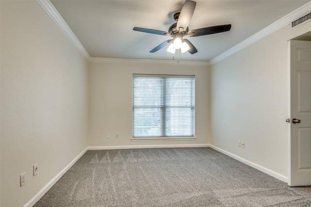 empty room featuring crown molding, ceiling fan, and carpet flooring