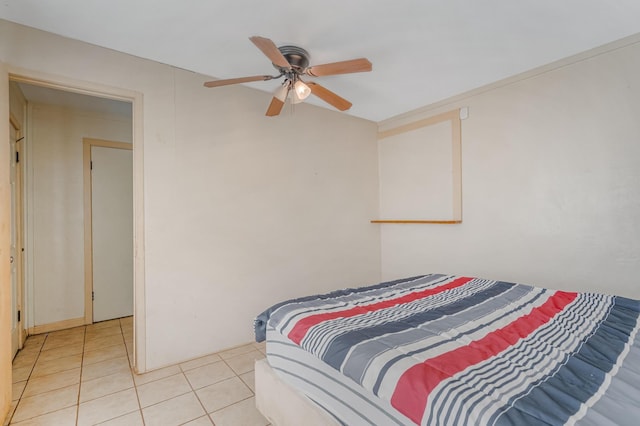 bedroom with light tile patterned floors and ceiling fan