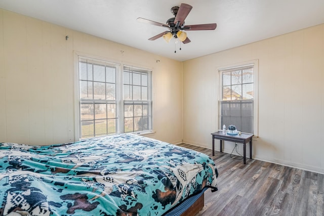 bedroom with hardwood / wood-style flooring and ceiling fan