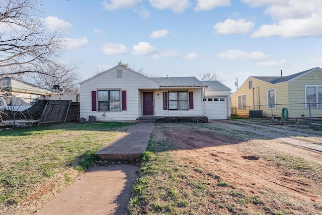 view of front facade with a garage and a front yard