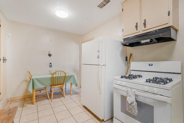 kitchen with white cabinetry, light tile patterned flooring, and white appliances