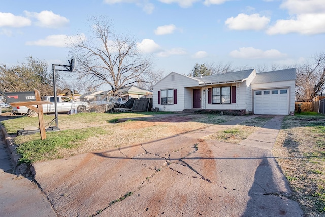 single story home featuring driveway, an attached garage, and fence