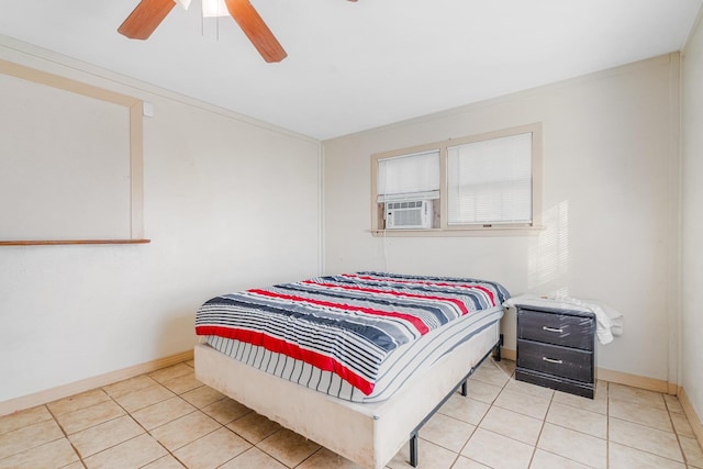 bedroom featuring light tile patterned floors, cooling unit, a ceiling fan, and baseboards