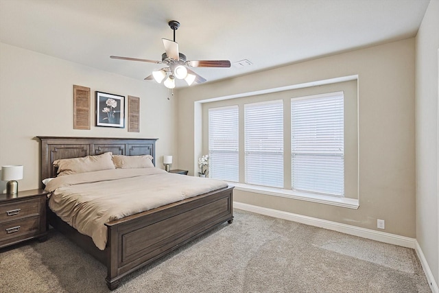 bedroom featuring light carpet and ceiling fan