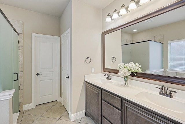 bathroom featuring vanity, tile patterned floors, and walk in shower