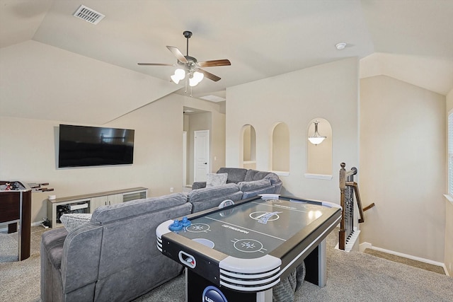 rec room featuring lofted ceiling, light colored carpet, and ceiling fan