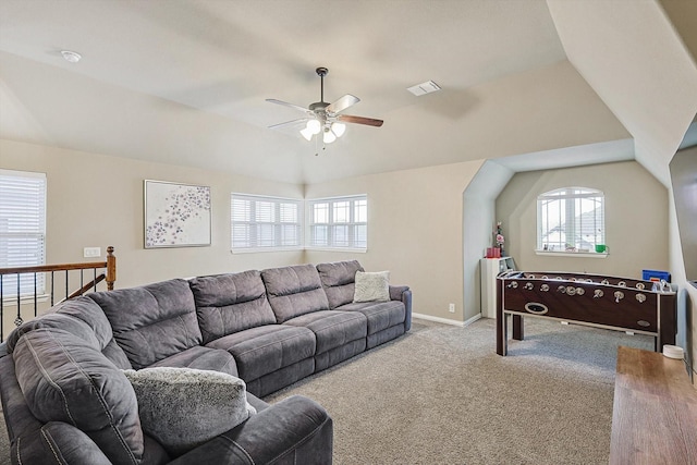 living room featuring carpet floors, ceiling fan, and vaulted ceiling