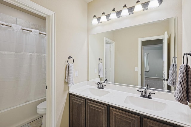 full bathroom with toilet, vanity, and shower / washtub combination