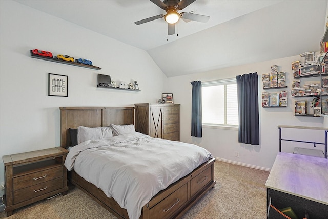 carpeted bedroom featuring ceiling fan and vaulted ceiling