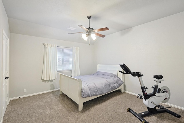 bedroom featuring vaulted ceiling, carpet floors, and ceiling fan