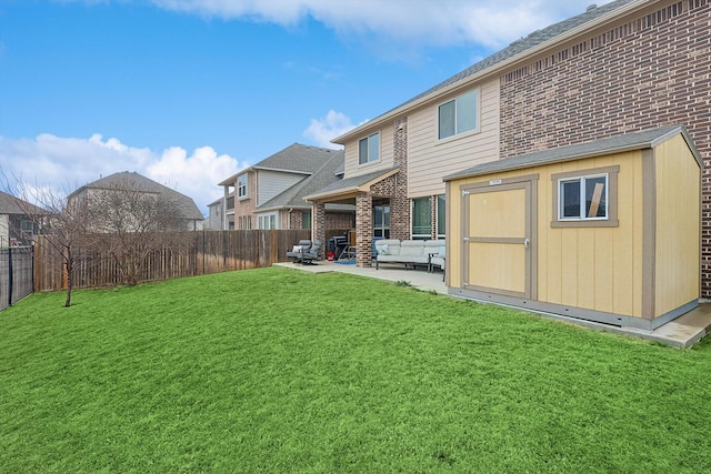 rear view of property with a storage shed, a yard, an outdoor hangout area, and a patio area