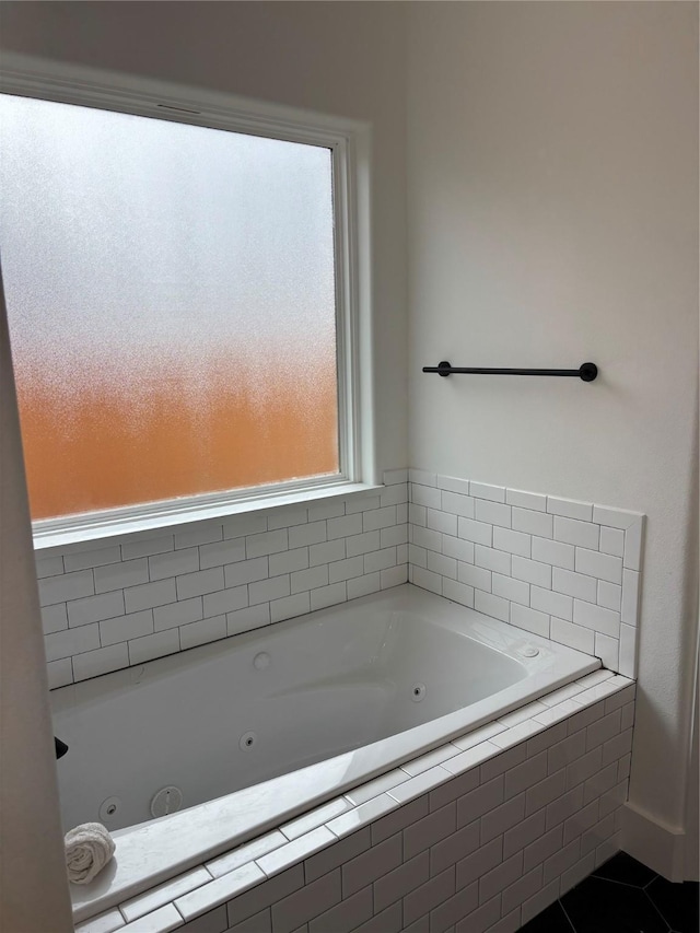 bathroom featuring tiled tub