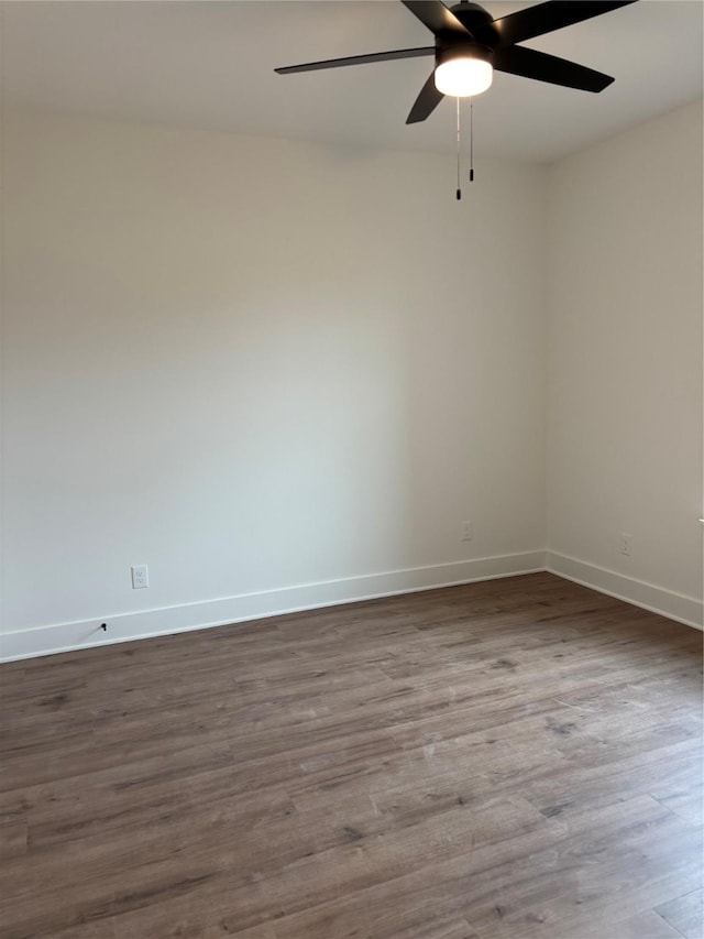 empty room featuring hardwood / wood-style flooring and ceiling fan