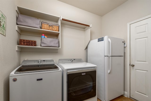 laundry room featuring laundry area and washing machine and clothes dryer