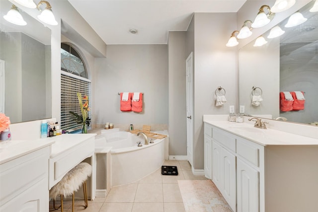 bathroom featuring tile patterned floors, a bathtub, and vanity