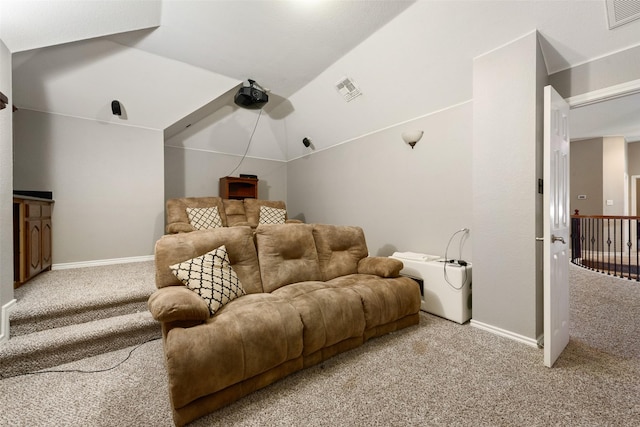 carpeted cinema room featuring lofted ceiling