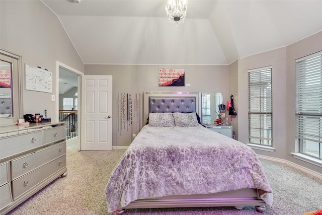 carpeted bedroom featuring lofted ceiling