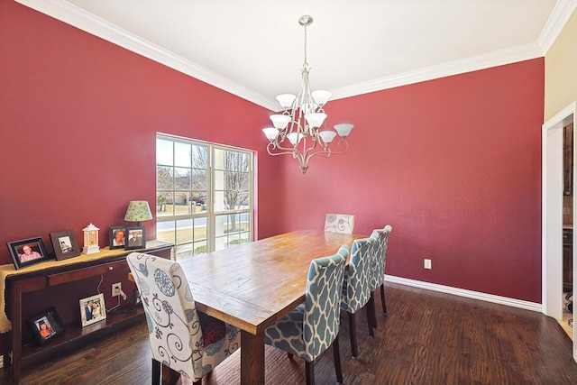 dining space featuring dark wood-type flooring, ornamental molding, and a chandelier