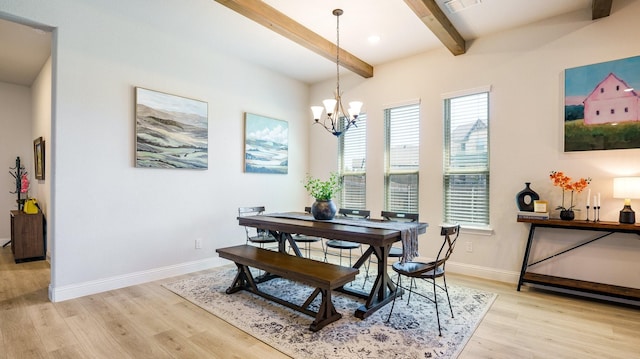 dining space featuring an inviting chandelier, beam ceiling, and light hardwood / wood-style floors