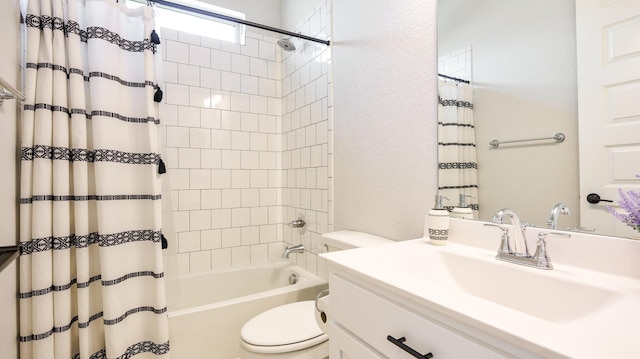 full bathroom with shower / tub combo with curtain, vanity, and toilet