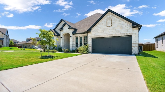 view of front facade with a garage and a front yard