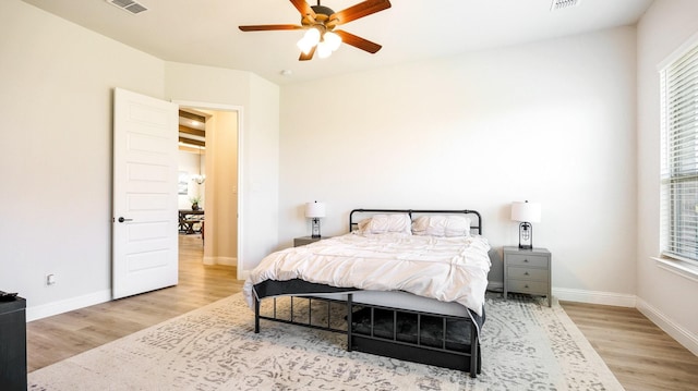 bedroom with ceiling fan and light wood-type flooring