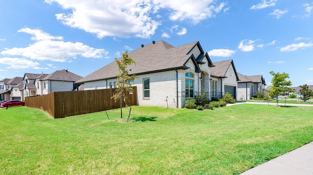 view of side of property featuring a lawn