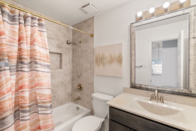 full bathroom featuring shower / bath combo, vanity, a textured ceiling, and toilet