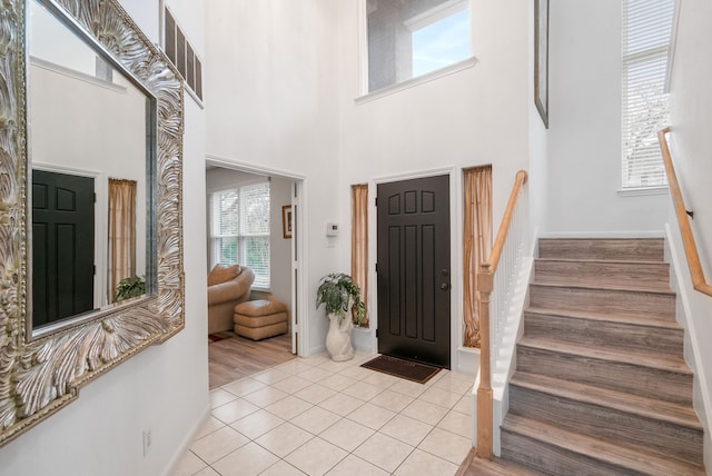 entrance foyer with light tile patterned floors