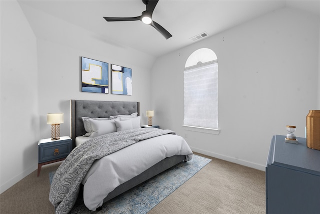 carpeted bedroom featuring lofted ceiling and ceiling fan