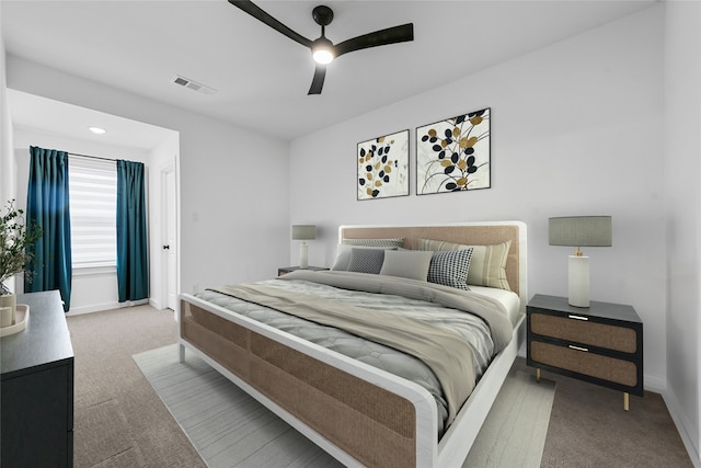 carpeted bedroom with ceiling fan