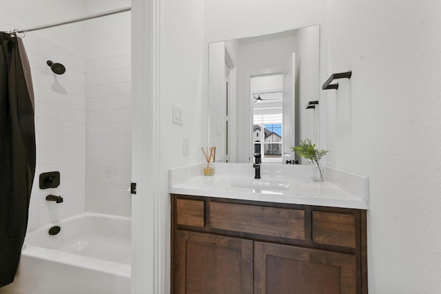 bathroom featuring vanity and shower / bathtub combination with curtain