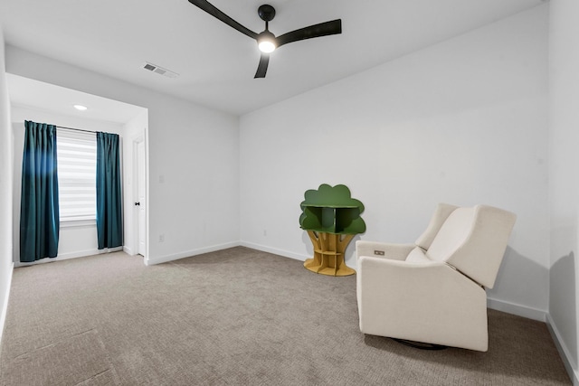 sitting room with carpet floors and ceiling fan